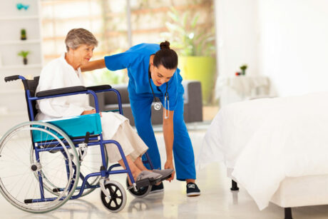 Patient in a Wheelchair with a Home Health Aide in Boca Raton, Boynton Beach, West Palm Beach, and Surrounding Areas